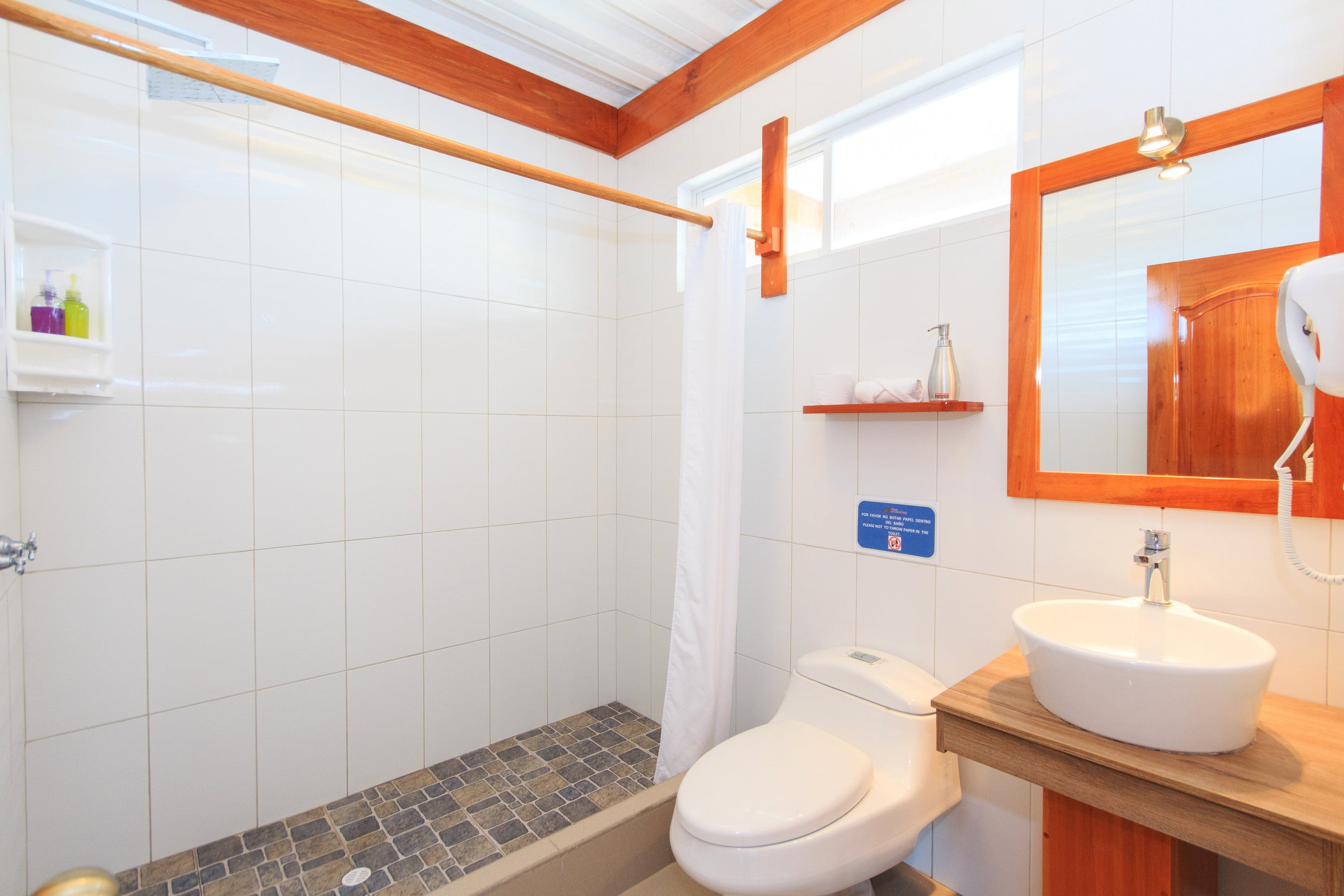 Small, clean bathroom with modest design and standard amenities.