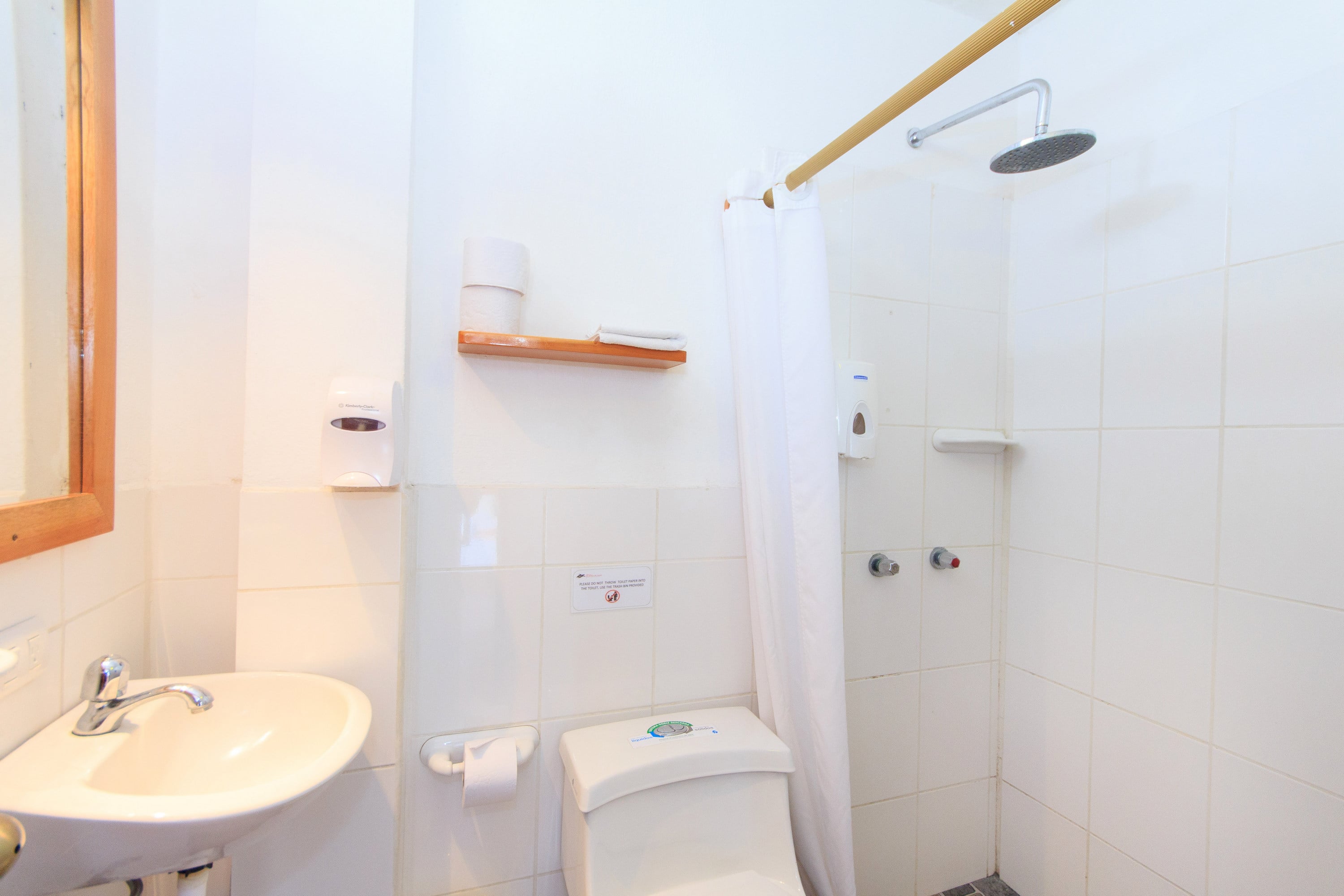 Small, clean bathroom with modest design and standard amenities.